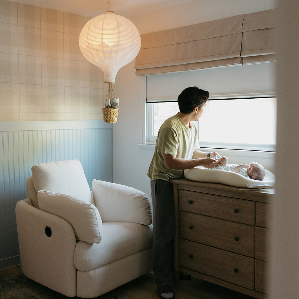 Child sleeping soundly in a blacked-out room
